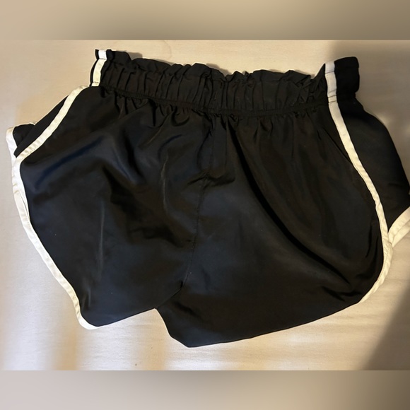 Nike dry fit shorts. Black with white stripe. Cinched around the waist. - Picture 2 of 2